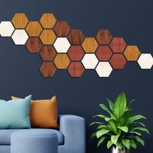 May include: A wall decor made of wooden hexagonal tiles in shades of brown, red, and white. The tiles are arranged in a wave-like pattern, creating a modern and geometric design.