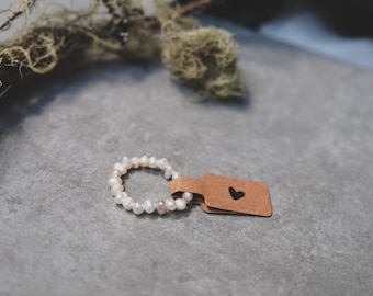 Anillo elaborado con perlas cultivadas de agua dulce.