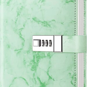 May include: A green marble-patterned journal with a combination lock and the word "Green" printed on the front cover.