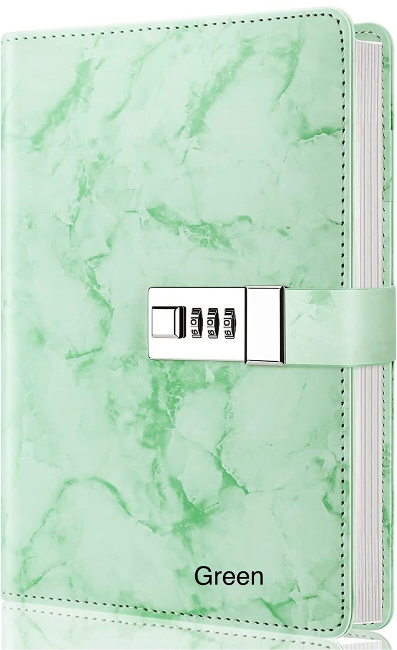 May include: A green marble-patterned journal with a combination lock and the word "Green" printed on the front cover.