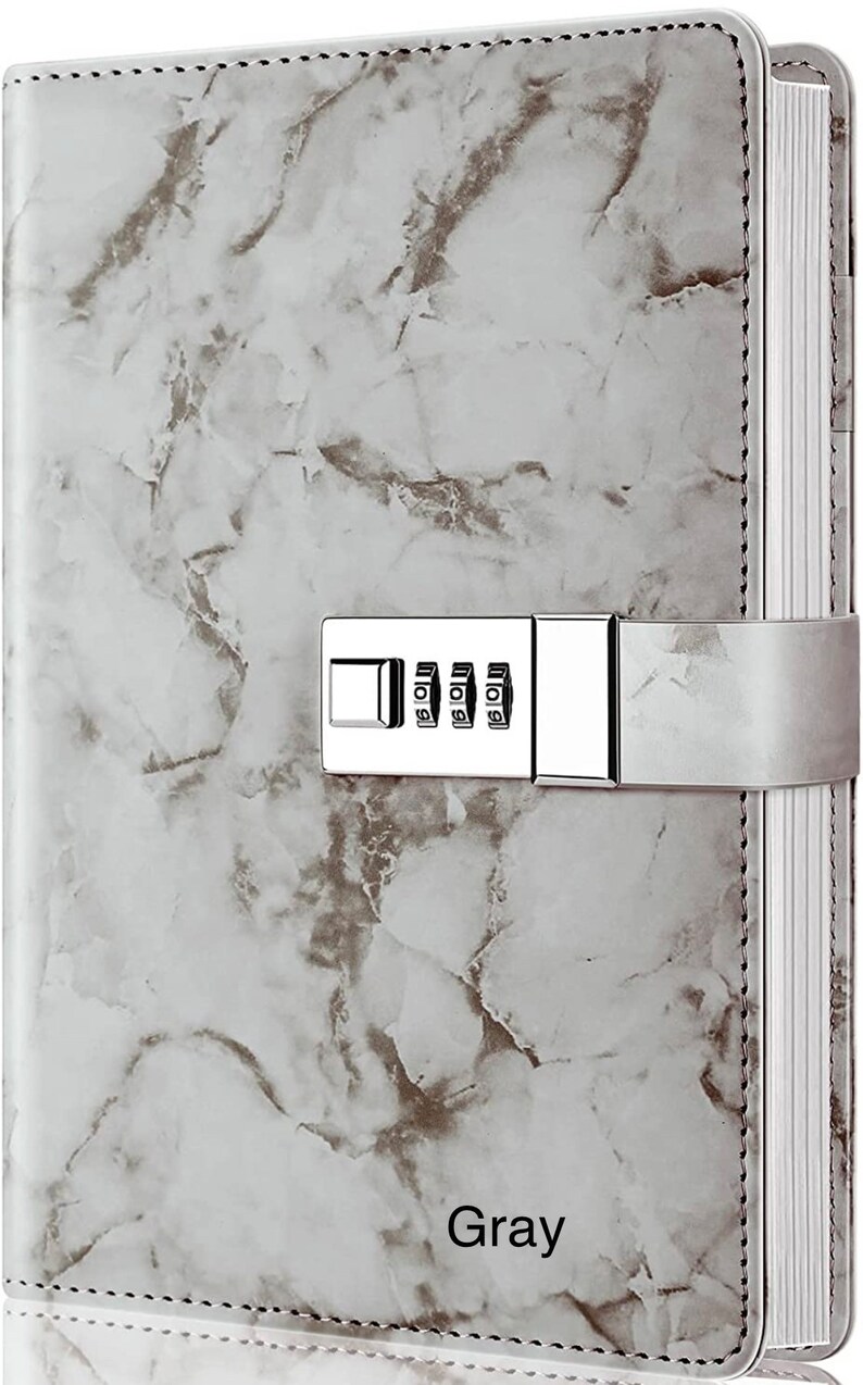 May include: Gray marble-patterned journal with a combination lock and a white spine. The journal has the word "Gray" printed on the front cover.