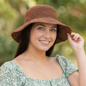 May include: A set of three ceramic mugs with a speckled, matte finish. The mugs are in shades of cream, light gray, and dark gray. Each mug has a simple, minimalist design, perfect for coffee or tea.