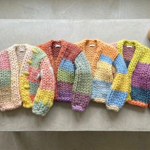 May include: A rustic wooden sign with the text "Welcome to our home" in a handwritten style. The sign features a distressed finish and a simple, inviting design, perfect for a front porch or entryway.