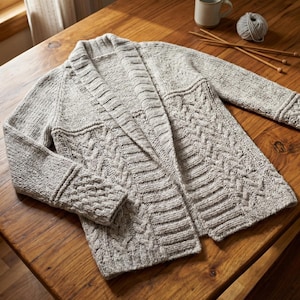 May include: A set of three ceramic mugs with a speckled, matte finish in cream, light grey, and dark grey. Each mug has a simple, minimalist design and a rounded handle.