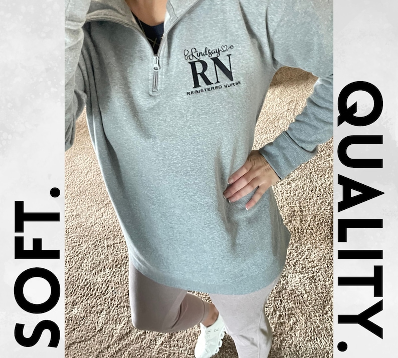 May include: Grey sweatshirt with a black embroidered design that says "Lindsay RN Registered Nurse".