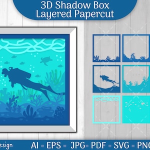 May include: A 3D shadow box papercut design featuring a scuba diver in blue, surrounded by coral and fish in shades of blue and green. The design is layered and ready to be cut out and assembled.