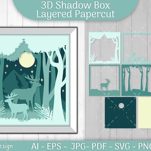 Könnte beinhalten: Ein 3D-Schattenbox-Papierdesign mit einer mondbeschienenen Waldszene mit zwei Hirschen, Bäumen und Bergen. Das Design ist geschichtet und wird in mehreren Teilen zur Montage geliefert. Das Bild enthält den Text "3D Shadow Box Layered Papercut" und "By: OtveyDesign".
