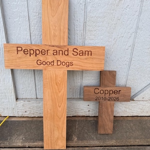 May include: A white ceramic mug with a black handle and the text "But First, Coffee" in a black, handwritten-style font. The mug is on a white surface.