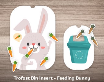 May include: Printable Trofast bin insert template featuring a white bunny with a carrot in its mouth and a blue recycling bin. The template includes a set of carrots to be used as game pieces.