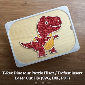 May include: A laser cut T-Rex dinosaur puzzle insert for Flisat or Trofast storage units. The puzzle is made of wood and features a red dinosaur with yellow accents. The insert is designed to fit into a Flisat or Trofast storage unit.