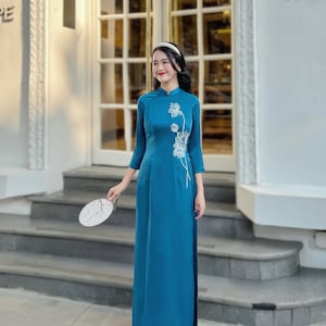 Blue Vietnamese traditional Ao Dai long dress with 3D flower lotus , including pants