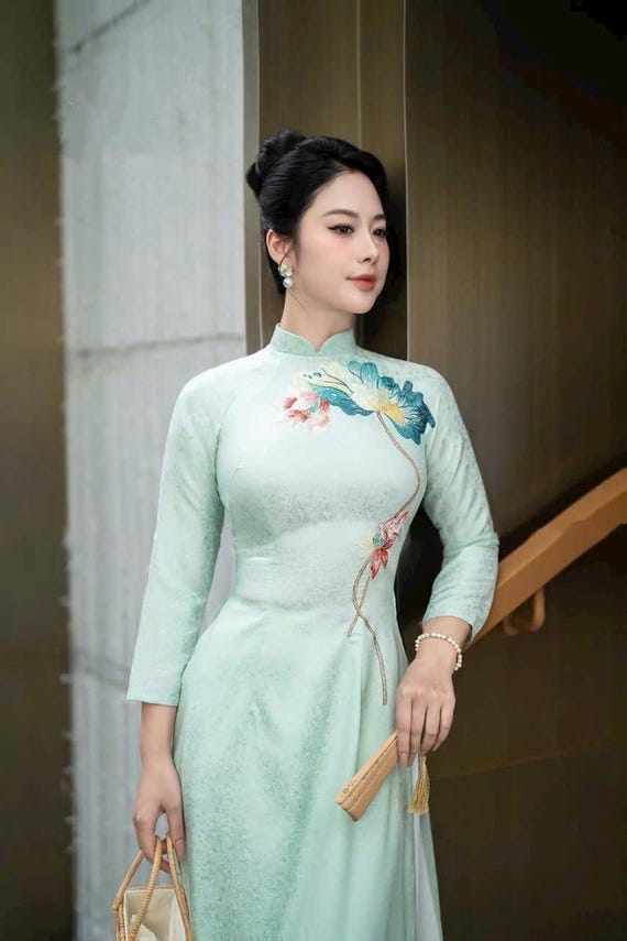 Green brocade Vietnamese traditional Ao Dai long dress with lotus design, including pants Green brocade Vietnamese traditional Ao Dai long dress with lotus design, including pants
