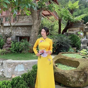 Yellow Vietnamese traditional Ao Dai long dress with 3D flower , including pants