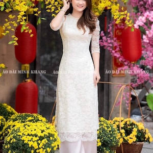 Creamy white Vietnamese traditional Ao Dai long dress , including pants