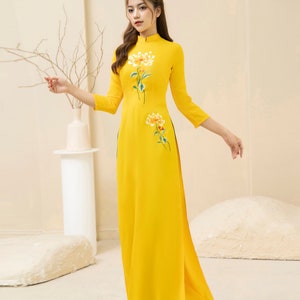 Yellow Vietnamese traditional Ao Dai long dress with 3D flower , including pants