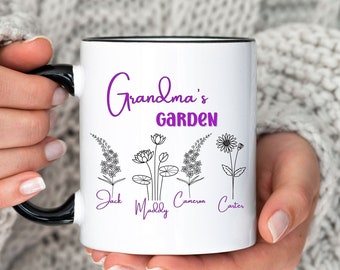 May include: White ceramic mug with a black rim and handle. The mug has a purple inscription that reads "Grandma's Garden" and features a line drawing of four flowers with names written below each flower: Jack, Maddy, Connor, and Carter.