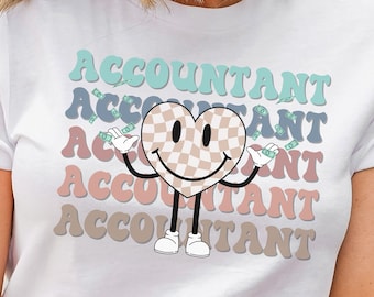 May include: White t-shirt with a retro-style graphic of a smiling checkered heart holding money with the word "ACCOUNTANT" repeated in different colors.