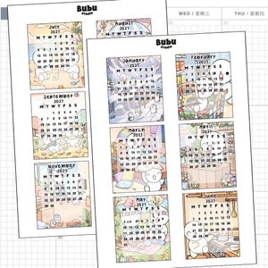May include: Two sheets of Bubu Studio 2027 calendar stickers featuring twelve monthly grids. Each month displays a cartoon character in various settings like a beach, snowy mountains, a grocery store, a bedroom, a garden, and a kitchen.