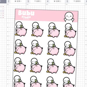 Könnte beinhalten: Bogen mit Planer-Aufklebern mit einem niedlichen Zeichentrickcharakter und einem Sparschwein. Die Aufkleber sind rosa und weiß, mit Goldmünzen. Der Text "Bubu Studio" befindet sich oben auf dem Bogen.