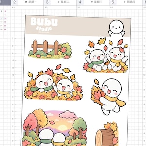 Könnte beinhalten: Ein Stickerbogen mit dem Branding von Bubu Studio und verschiedenen Illustrationen von weißen, runden Charakteren in einer herbstlichen Umgebung. Die Motive zeigen Charaktere, die in Herbstlaub spielen, Schals tragen, an einem Holzzaun stehen und eine Sonnenuntergangslandschaft.