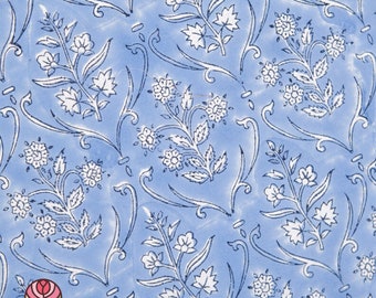 May include: A blue fabric with a white floral pattern. The pattern features small flowers and leaves.
