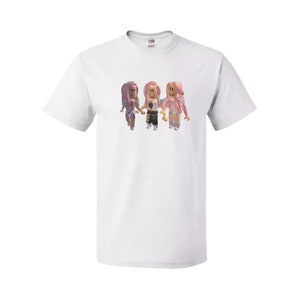 May include: White t-shirt with a graphic of three cartoon girls with pink hair and colorful outfits.