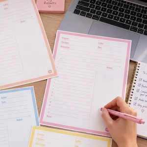 May include: A set of four coding log sheets in pastel pink, blue, and yellow, each featuring fields for program name, file name, author, date, and description, alongside a numbered list for code lines and a dedicated output section for programming.