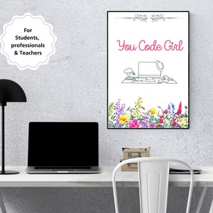 May include: A white framed poster with the text "You Code Girl" in pink lettering. The poster features a line drawing of a computer with a flower pot and a coffee cup on the desk. The poster is surrounded by a border of watercolour flowers in shades of pink, yellow, and purple.