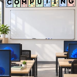 May include: A classroom setting featuring rows of computer desks with monitors and a large white board. Above the board, ten framed posters display the letters C-O-M-P-U-T-I-N-G, each decorated with various colorful technology-themed icons.
