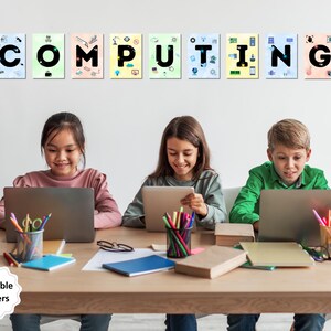 May include: A classroom setting with four students working on laptops. The wall behind them has colorful posters spelling out the word "COMPUTING".