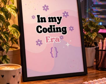 May include: A framed print featuring a light pink and purple wavy background with the text In my Coding Era in black and white retro-style font. The design includes purple flower icons, small sparkles, and a pair of curly brackets at the bottom.