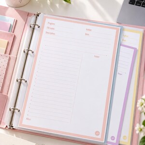 May include: A light pink three-ring binder containing white coding log pages with pastel borders. The pages feature fields for Program, File name, Author, Date, Description, and Output, with a numbered list for lines of code and a section for Notes.