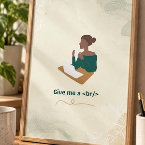 May include: A framed wall art print featuring a light beige background with subtle white circular patterns and decorative corner flourishes. A central illustration shows a person in a dark green top sitting at a desk with a laptop and mug. Text reads: Give me a <br/>.