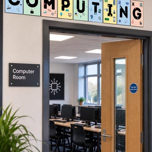 May include: A wall sign above a doorway featuring the word COMPUTING in large black letters, with each letter displayed on a separate rectangular panel decorated with various small colorful technology-themed icons and illustrations.