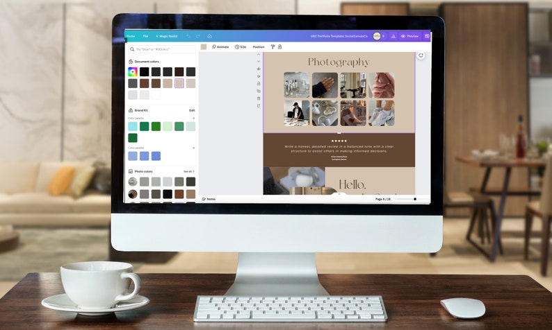 May include: A computer screen displaying a website design template with a brown background and the word "Photography" in a white font. The website design includes a grid of nine images, a text block, and a "Hello" greeting. The screen is surrounded by a white frame and is sitting on a wooden desk.