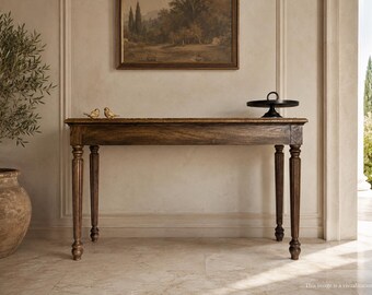 May include: A rectangular wooden console table with a dark brown finish and four fluted, turned legs. The table surface holds two small gold-coloured bird figurines on the left and a black circular pedestal stand on the right side.