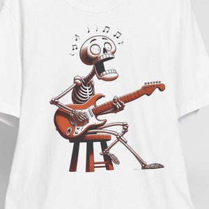 Rockin&#39; Skeleton Unisex Tee, Musician Graphic Shirt, Skeleton Guitarist Top, Music Lover Gift, Skeleton Band Concert T-Shirt