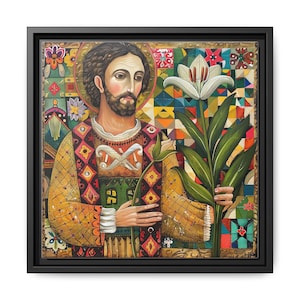 May include: A framed artwork depicting a religious figure with a halo, holding a white lily. The figure is dressed in a yellow and patterned garment. The background is a mosaic of colourful geometric and floral patterns. The frame is black.
