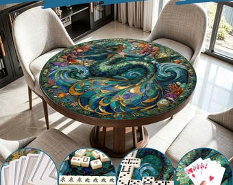 May include: A round wooden table featuring a circular tabletop with a vibrant stained-glass style illustration of a mermaid surrounded by ocean waves, coral, and shells. The table is shown with playing cards, mahjong tiles, and dominoes.
