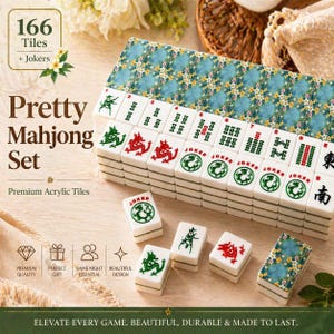 May include: A Pretty Mahjong Set with 166 tiles and Jokers. The set includes premium acrylic tiles with green and red dragon designs, and a blue floral patterned case. The text on the box says "Elevate every game. Beautiful, durable & made to last."
