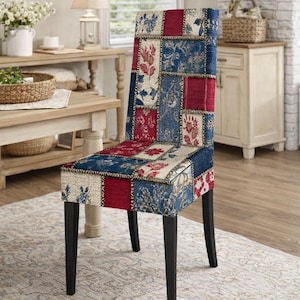 May include: A dining chair with a patchwork design in red, blue, and cream. The chair has a high back and black legs. The fabric features floral and geometric patterns. The text "1 Chair Cover" is at the bottom.