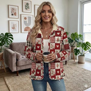 May include: A red, white, and brown patchwork jacket with a floral and heart pattern. The jacket has a cream-colored collar and is buttoned up. The jacket is paired with blue jeans.