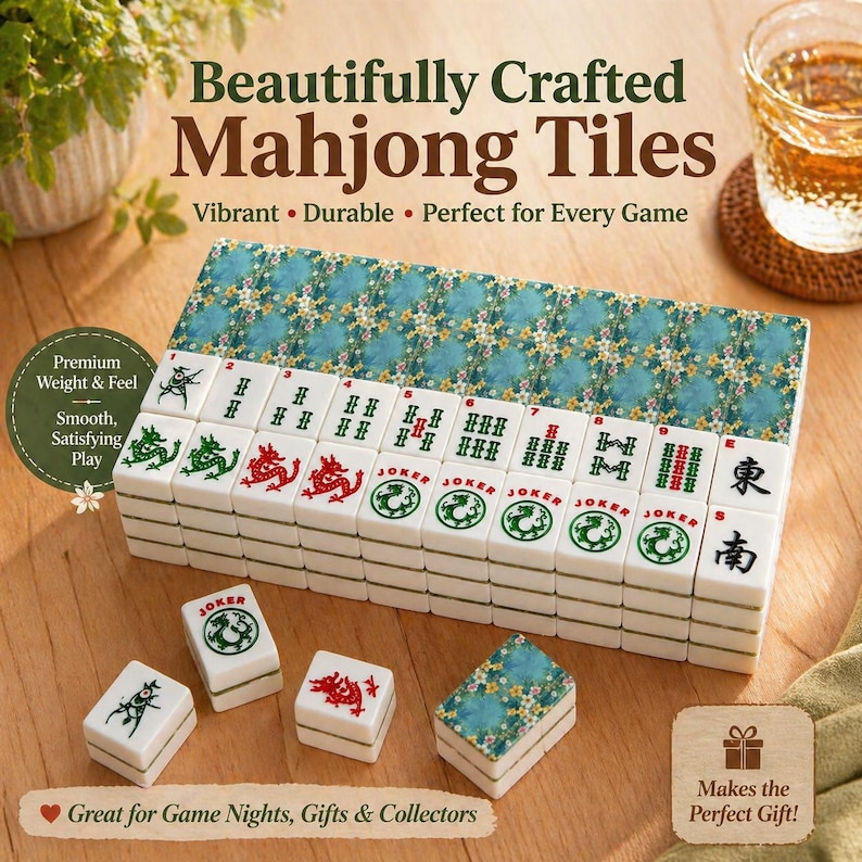 May include: A complete Mahjong tile set with a teal floral patterned case. The white tiles feature red and green symbols and characters. The text on the case reads "Beautifully Crafted Mahjong Tiles".