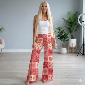 May include: Red and cream patchwork palazzo pants with heart and floral patterns. The pants feature a high waist and wide legs. The design includes various shades of red and cream, with the word "XOXO" printed on the fabric.