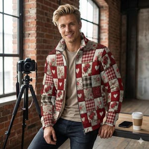 May include: A quilted jacket with a patchwork design featuring red, white, and brown squares. Some squares have hearts and floral patterns. The jacket has a zipper closure and a collar.