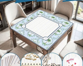 May include: Wooden game table with a light blue surface featuring a palm tree design. The table is surrounded by chairs and has a variety of games displayed, including cards, mahjong tiles, and dominoes. The text "Wide Range of Uses" is at the top.