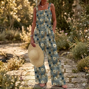 May include: A white ceramic mug with a black handle and the text "But First, Coffee" in a bold, black font. The mug is set against a blurred background, suggesting a cozy setting.