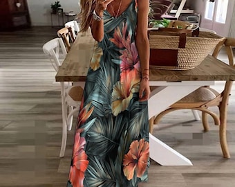 May include: A sleeveless maxi dress with a V-neckline and a floral print featuring large pink, orange, and yellow flowers on a dark green background.