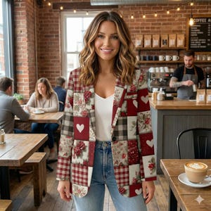 May include: A patchwork blazer with a mix of patterns, including red and white hearts, floral prints, and plaid. The blazer is worn with a white top and blue jeans. The background is a coffee shop setting.