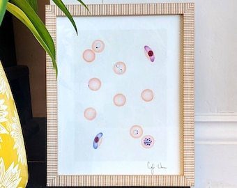 May include: A framed illustration of various cells in shades of pink, purple, and blue on a white background. The artwork is signed "Cyfe Chen" in the bottom right corner.